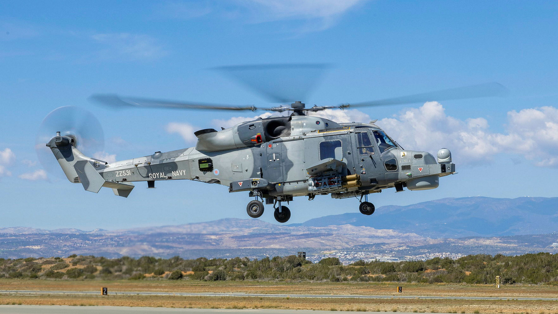 Three Royal Navy Wildcat attack helicopters from 815 Naval Air Squadron have arrived at the station