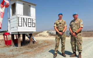 Sapper Stephen Brickell and Captain Mike Owens pose together in Cyprus during the reservist's first operational deployment (Picture: BFBS)