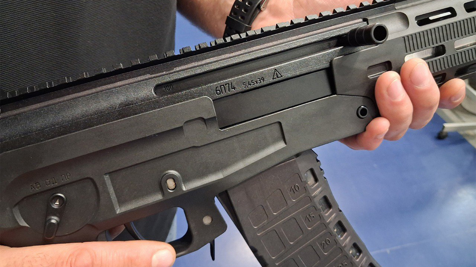 Note the clear viewing windows on the polymer magazine to judge how many rounds are remaining and the change lever at the rear