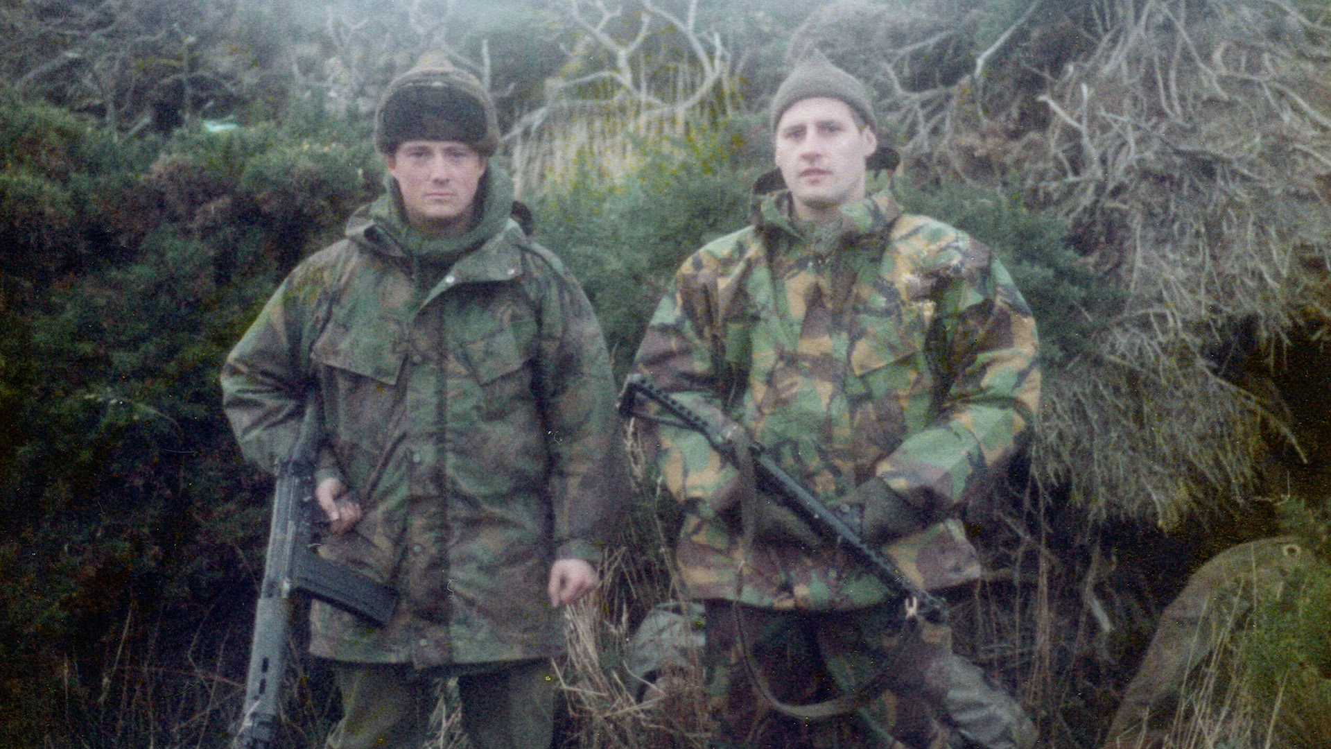 Lt Col (Ret'd) Sherrington (left) with LCpl Sandy Bagall soaking wet guarding the beachhead of San Carlos (Picture: Brian Sherrington)