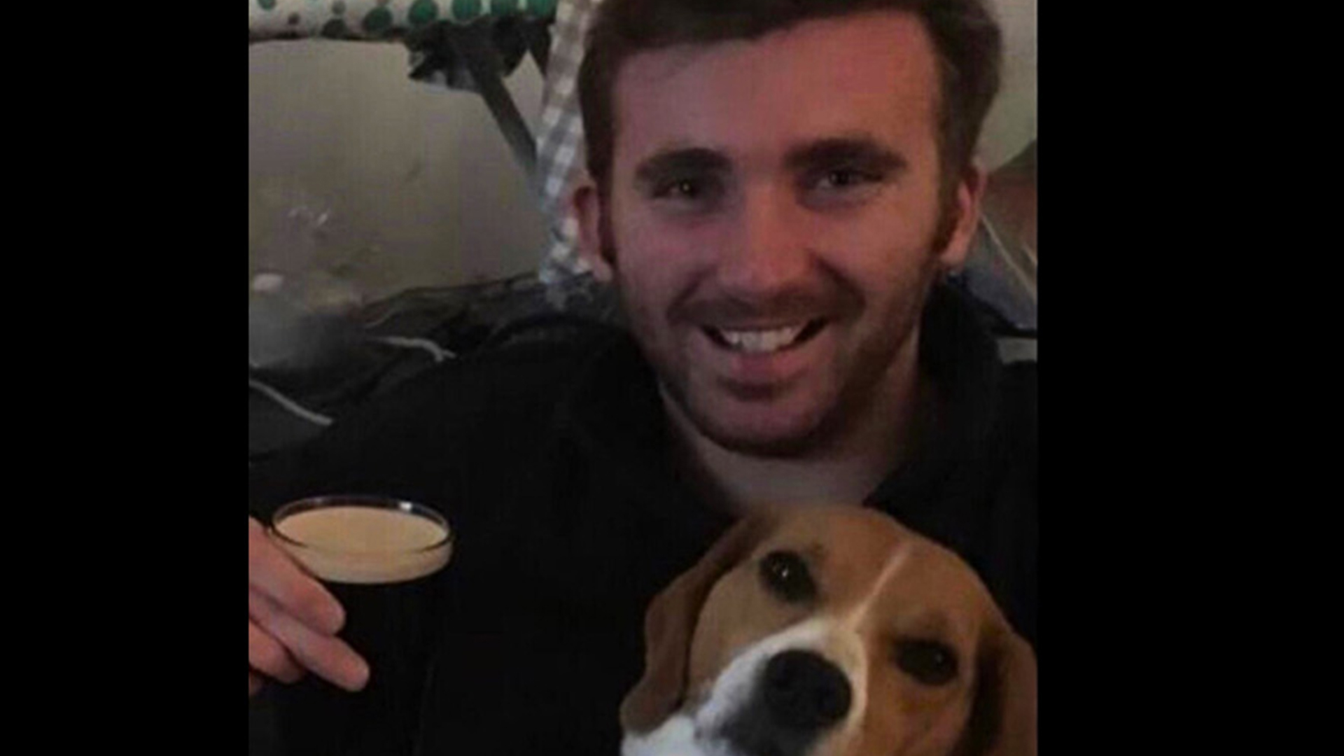Lance Corporal George Hooley pictured enjoying a drink with his dog Mabel by his side (Picture: MOD)