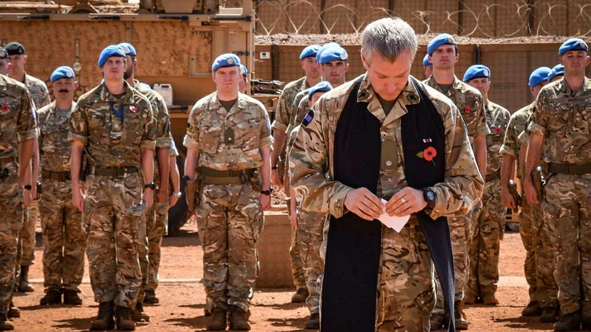 The British Army's Padre Wylie leading the Long Range Reconnaissance Group in prayer during the service of Remembrance at their base in Gao, Mali in November 2021 CREDIT Crown Copyright