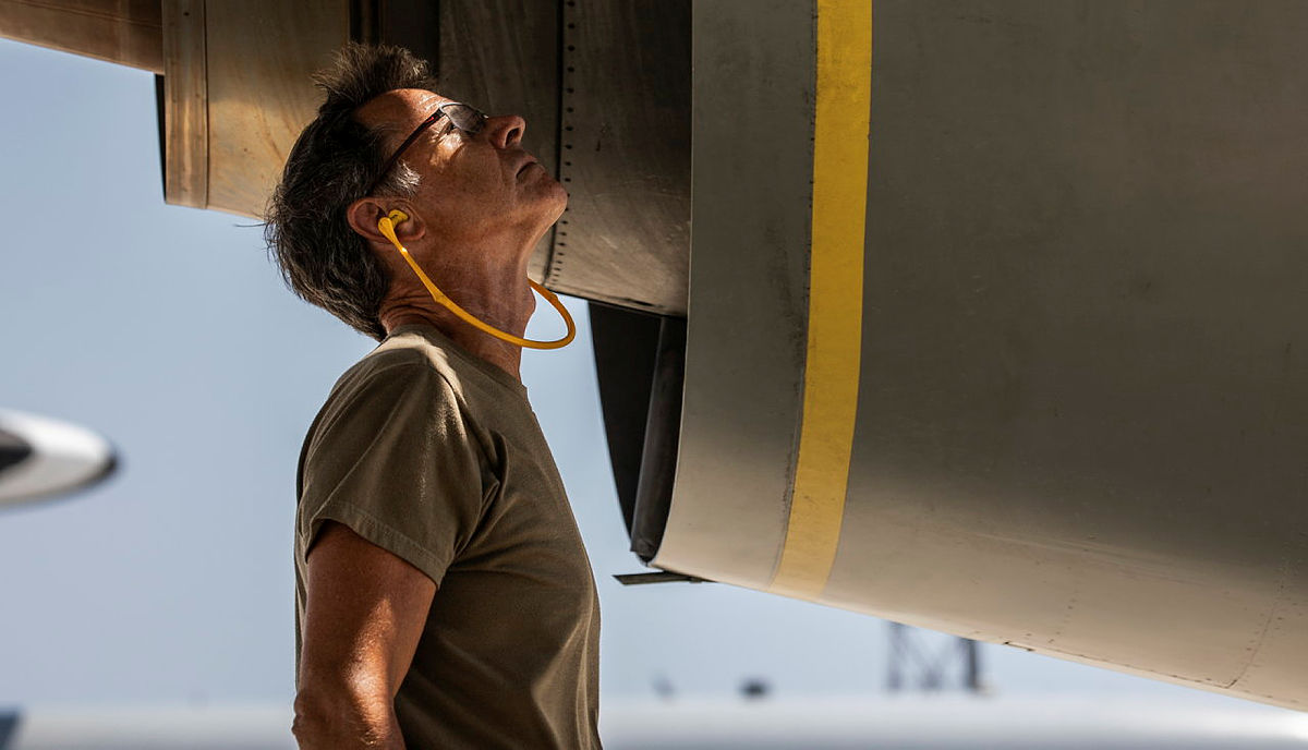 An RAF Ground Engineer wears ear protection as he sees off an E-3D Sentry as it conducts a mission over Iraq in support of Op Shader
