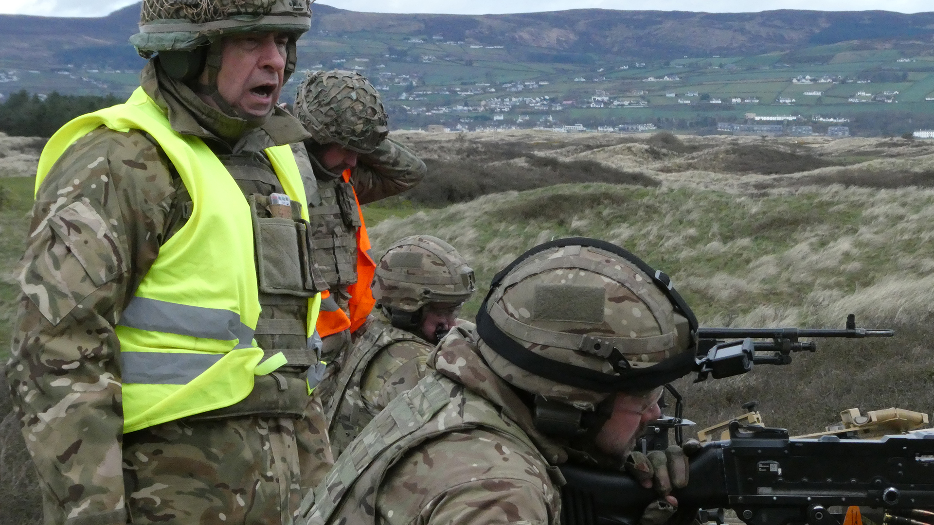 Captain Si Talbot oversees the firing of the GPMGs - the reservists must prove their competency with the weapon both on and off the Jackal