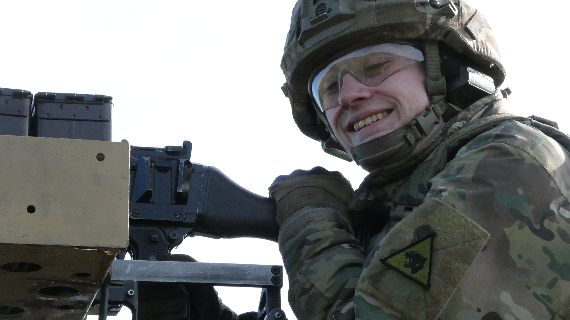 Knowing you've done a good job is enough to put a smile on anyone's face - in this case the soldier manning the Gympy on the Jackal