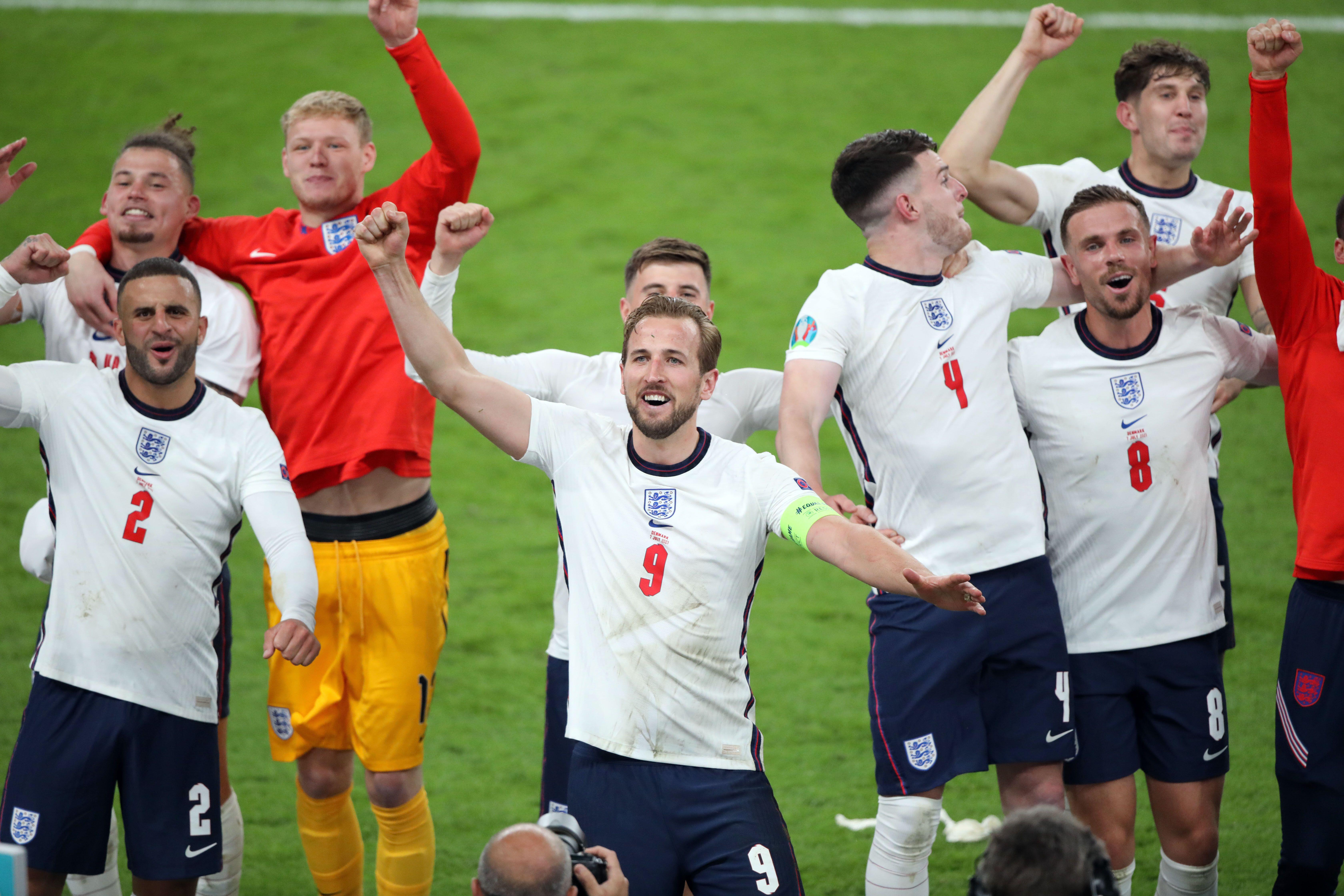 The England players, led by captain Harry Kane, celebrate after securing a place in the final