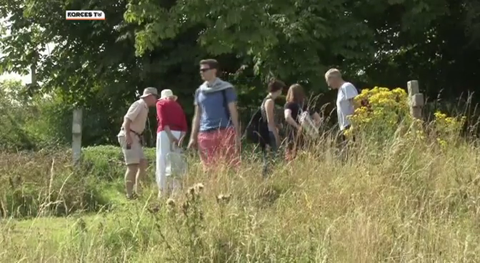 Visitors inspect graves around Imber Church