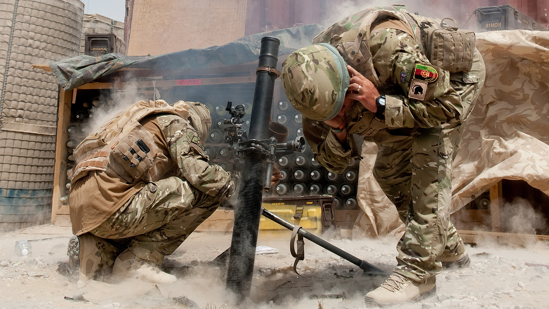 A mortar team fires on insurgents outside Forward Operating Base Khar Nikar in Afghanistan (Picture: MOD)