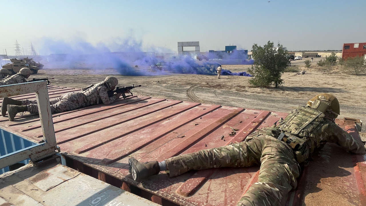 Troops from the UK and Kuwait training their weapons skills in the desert