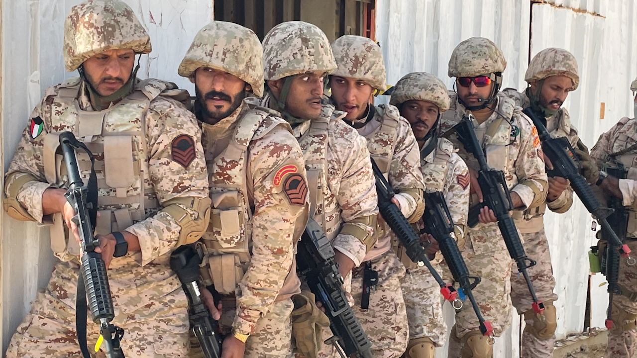 Kuwaiti soldiers stack up ready to clear a building