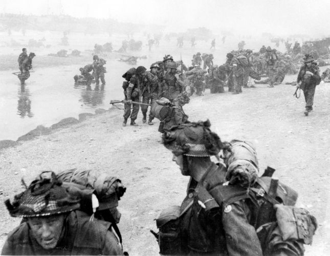 British soldiers struggle ashore on Sword beach (Picture: Pictorial Press Ltd/Alamy Stock Photo). British soldiers struggle ashore on Sword beach