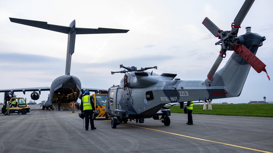 Before the Wildcats can be loaded on board the C-17, they need to be prepped for transit, the most obvious bit of work being the removal of the main rotor blades Before the Wildcats can be loaded on board the C-17, they need to be prepped for transit, the most obvious bit of work being the removal of the main rotor blades