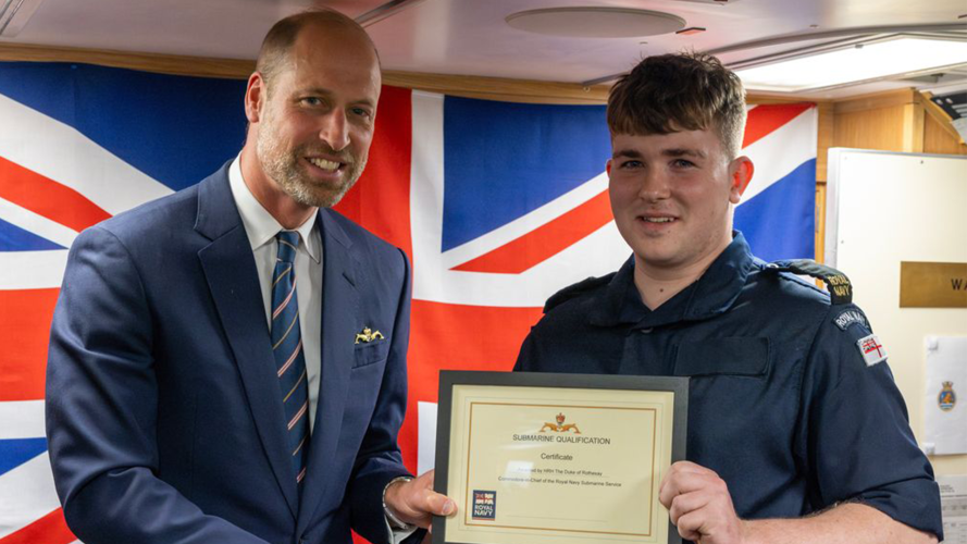 The Commodore-in-Chief of the Royal Navy's Submarine Service congratulated qualified submariners (Picture: MOD) The Prince of Wales presented the Gold Submariner's Dolphin to qualified submariners