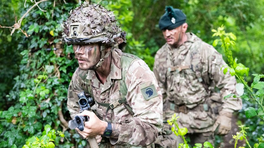 A competitor works his way through the sword lane under the watchful eye of a Royal Irish Regiment instructor, who is assessing his progress while making sure he stays safe A competitor works his way through the sword lane under the watchful eye of a Royal Irish Regiment instructor, who is assessing his progress while making sure he stays safe