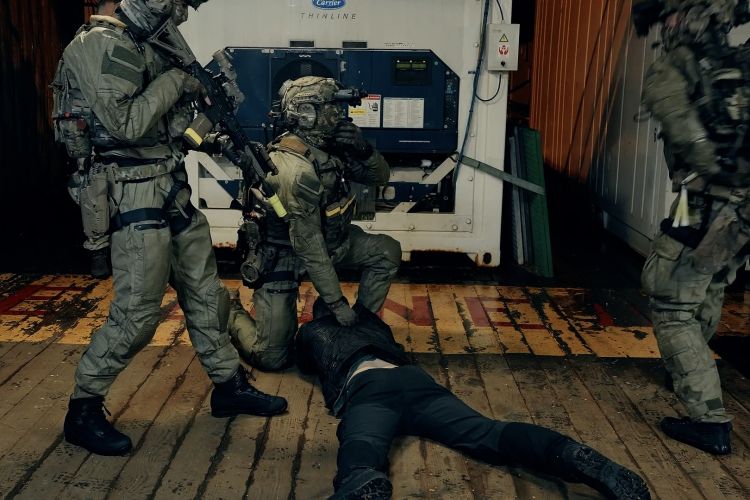 In hostage situations, one marine is responsible for handling while another provides overwatch One marine is responsible for handling the hostage, while another provides security