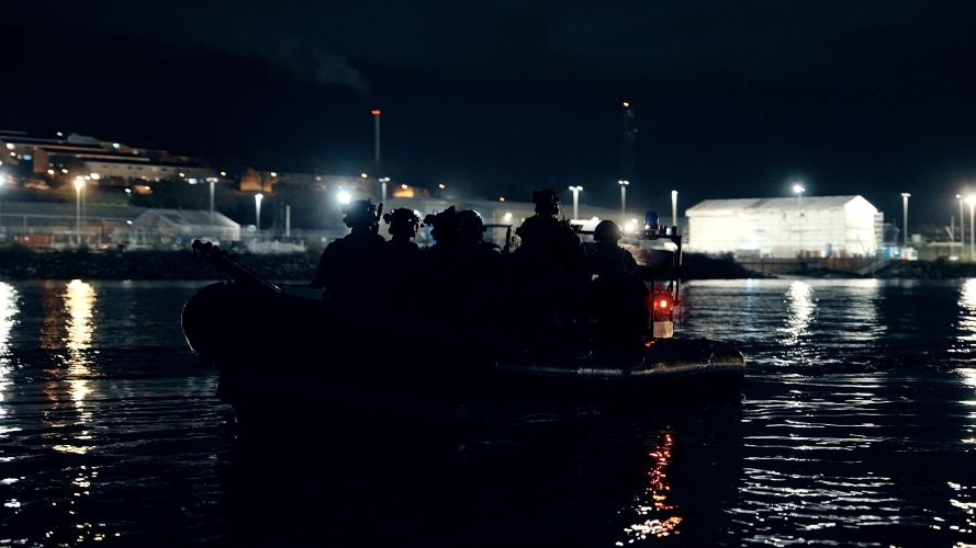 In the dead of night, Royal Marines from 42 Commando embark towards the auxiliary ship SD Northern River in Devonport naval base In the dead of night, Royal Marines from 42 Commando embark towards the auxiliary ship SD Northern River in Devonport Naval Base