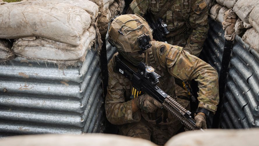 Soldiers from the Royal Australian Regiment carry out trench warfare drills during the quick attack phase of Cambrian Patrol, an exercise run by the British Army for international and mixed-nation teams Soldiers from the Royal Australian Regiment carry out trench warfare drills during the quick attack phase of Cambrian Patrol, an exercise run by the British Army for international and mixed-nation teams