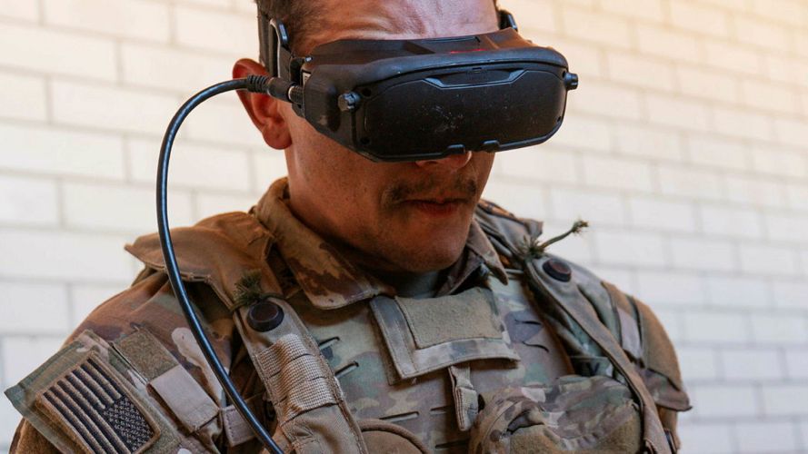 This US soldier attempts to locate the British troops in the field as he operates a first person view attack drone from the comfort of a building This US soldier attempts to locate the British troops in the field as he operates a first person view attack drone from the comfort of a building