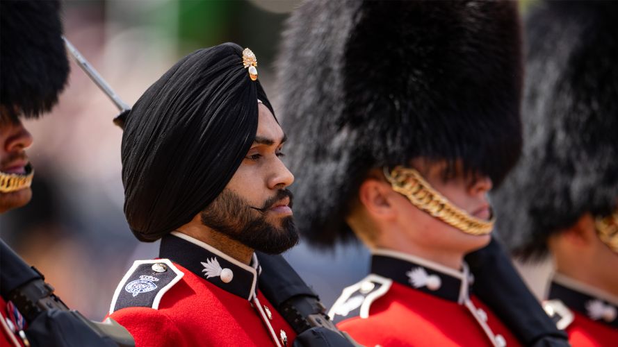 While all five regiments of the Foot Guards are known for their bearskin caps, not all those formed up among the Grenadier Guards were wearing one While all five regiments of the Foot Guards are known for their bearskin caps, not all those formed up among the Grenadier Guards were wearing one