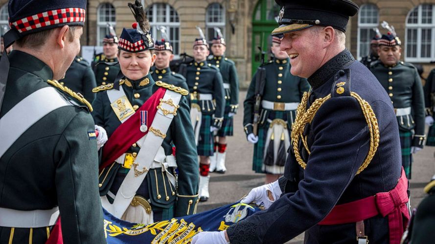 Lieutenant Colonel Foinette shares a joke with Lieutenant Thomas of Balaklava Company's Colour Party Lieutenant Colonel Foinette shares a joke with Lieutenant Thomas of Balaklava Company's Colour Party
