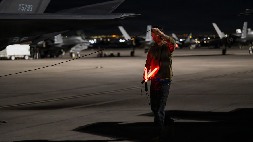 A crew chief, assigned to the 325th Fighter Wing, Tyndall Air Force Base, Florida, conducts final checks before a night mission during Exercise Red Flag A crew chief, assigned to the 325th Fighter Wing, Tyndall Air Force Base, Florida, conducts final checks before a night mission during Red Flag