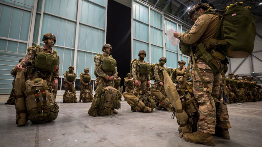 French paras from 11e Brigade Parachutiste get a final briefing in the hangar before boarding their aircraft for the drop with their colleagues from the UK (Picture: French defence ministry) French paras from 11e Brigade Parachutiste get a final briefing in the hangar before boarding their aircraft for the drop with their colleagues from the UK (Picture: French defence ministry)