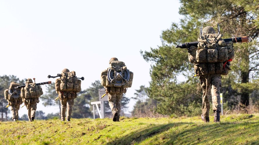 Paras from the mortar platoon patrol away from the drop zone carrying two 81mm mortar tubes and their baseplates in addition to their personal kit (Picture: MOD) Paras from the mortar platoon patrol away from the drop zone carrying two 81mm mortar tubes and their baseplates in addition to their personal kit (Picture: MOD)