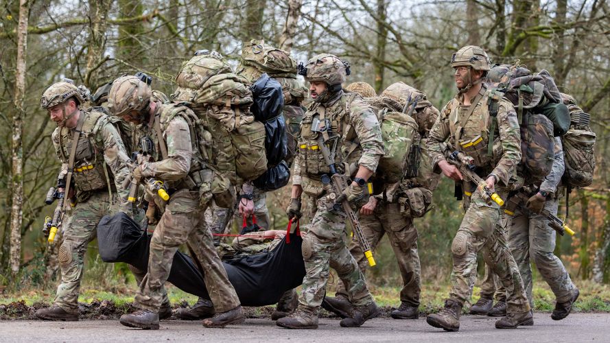 Soldiers from 2 Para extract a casualty during Exercise Orion in France; hauling a stretcher is something they are very familiar with, having done the stretcher race on P Company Soldiers from 2 Para extract a casualty during Exercise Orion in France - hauling a stretcher is something they are very familiar with, having done the stretcher race on P Company