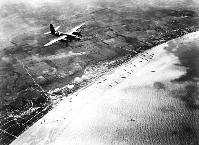 American B-26 Marauder returns to UK base, flying across the invasion on Sword beach (Picture: Pictorial Press Ltd/Alamy Stock Photo). American B-26 Marauder returns to UK base, flying across the invasion on Sword beach