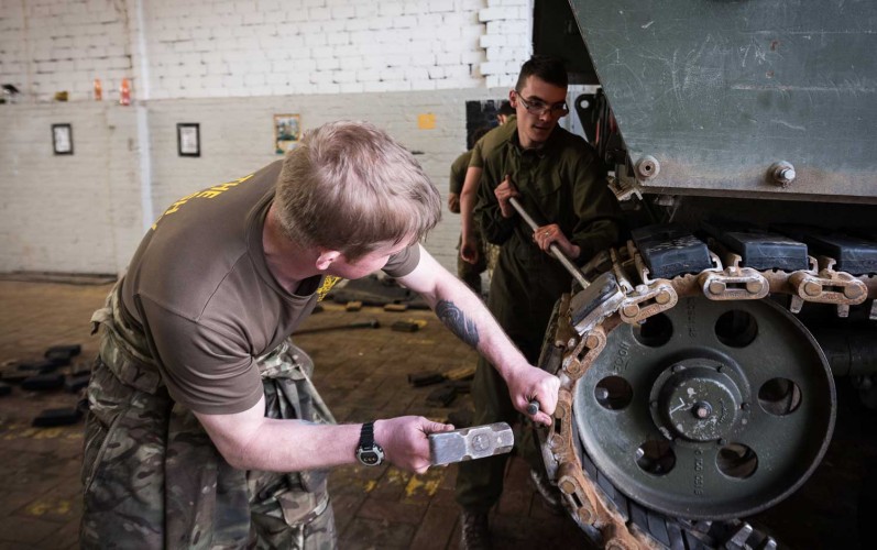 REME Mechanics Change Rubber Parts On An AS90 Track REME Mechanics Change Rubber Parts On An AS90 Track