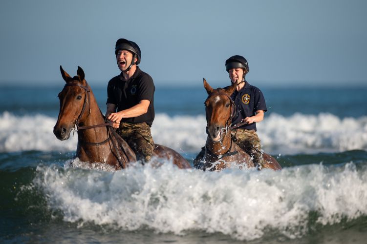 (Picture: PA) Soldiers and horses from The King's Troop Royal Horse Artillery exercise in the sea at Holkham in Norfolk