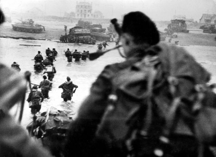 Commandos land ashore on D-Day (Picture: PA). Commandos land ashore on D-Day