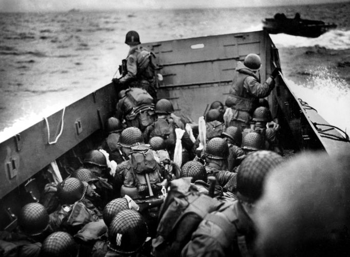 American soldiers in a landing barge sail across the Channel ahead of landing in Normandy (Picture: TopFotoP/PA). American soldiers in a landing barge sail across the Channel ahead of landing in Normandy (Picture: TopFotoP/PA).