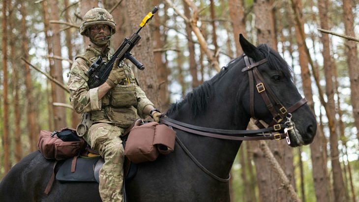 Lance Corporal of Horse Ben Chapman holds his SA80 L85A2 in the low port position during a mounted exercise on the Barossa Training Area at Sandhurst (Picture: MOD)
