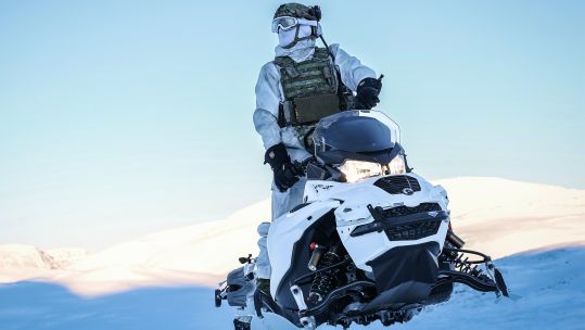 A member the Surveillance and Reconnaissance Squadron from 30 Commando operates an Oversnow Reconnaissance Vehicle in Norway