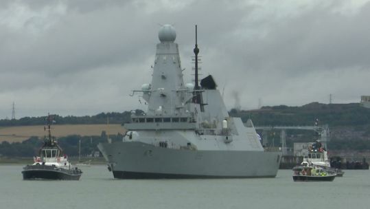 Dodging squally showers, HMS Dauntless set sail from her home port of Portsmouth for a period of training (Picture: BFBS)