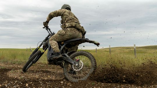 A soldier from 2 Para's Anti-Tank Platoon rides across the prairie on an e-bike during Exercise Rhino Bizz at British Army Training Unit Suffield in Canada - an area better known as BATUS (Picture: MOD)