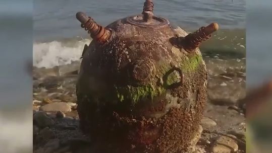 Big sea mine on shore of black sea