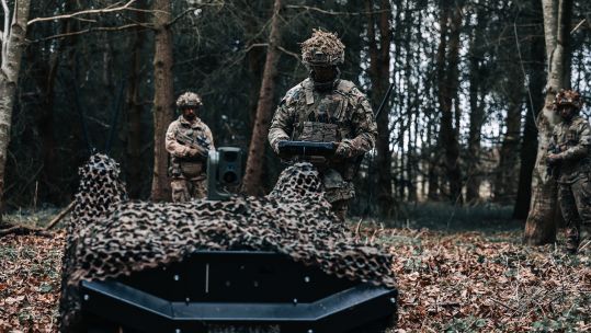 Soldiers use the Gereon RCS uncrewed ground vehicles in a forest CRED ARX Robotics