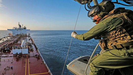 The Merlin carried officers from the National Crime Agency and extra items of kit on board the Cameroon-registered tanker (Picture: MOD)