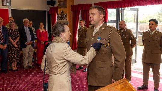 The Princess Royal, who acts as Colonel-in-Chief for the Royal Logistic Corps, pins the medal on Capt Livingstone (Picture: MOD)