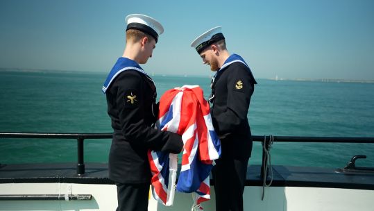 Leading Hand Kurt Tarrant and his fellow committals assistant carry out their duties committing ashes to the sea (Picture: BFBS)