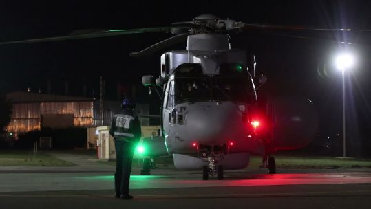 The pilot gives a thumbs up as he prepares to start the engines of the Merlin Mk2 Crowsnest