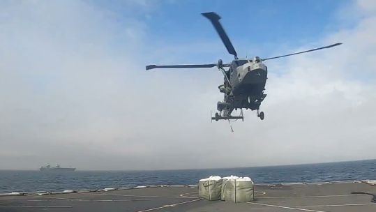 HMS Duncan is resupplied from HMS Prince of Wales