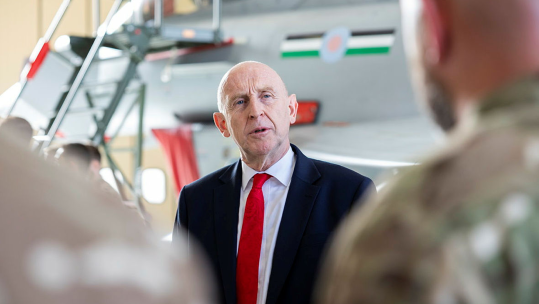 Mr Healey pictured visiting British troops in Qatar in his previous role as defence secretary (Picture: MOD)