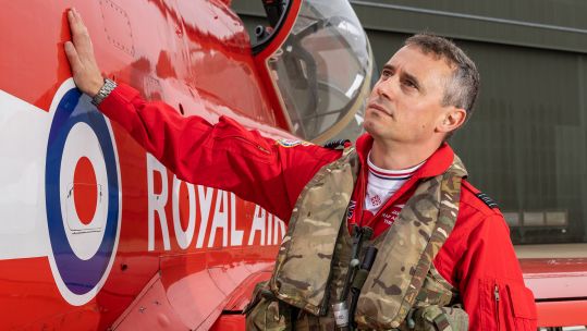 Squadron Leader James Turner runs an affectionate hand over his Hawk T1 – an aircraft he'll be spending countless hours in over the 2027 season (Picture: MOD)