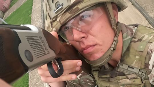 This RLC soldier is firing a laser shotgun - while on the move - at a fast-flying drone, training to counter the threat his unit might face in war (Picture: BFBS)