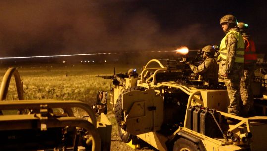 The reservists light up the night sky with tracer rounds as they take part in one of the key phases of the Platform Weapon Operators Course