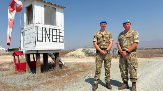 Sapper Stephen Brickell and Captain Mike Owens pose together in Cyprus during the reservist's first operational deployment (Picture: BFBS)