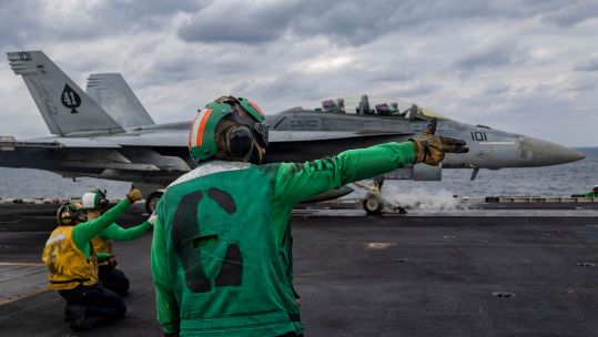 An F/A-18F Super Hornet attached to Strike Fighter Squadron (VFA) 41 prepares to launch from the flight deck of USS Abraham Lincoln in the Arabian Sea